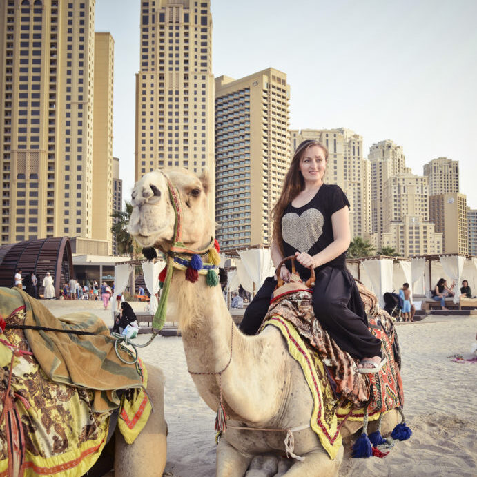 Riding a camel in Dubai. Come for free to dubai as a reward for being a strong leader part of GLtribe experience. 